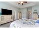 A spacious main bedroom featuring a large television and coordinating dressers for ample storage at 206 Marley Ct., Conway, SC 29526
