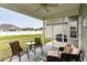 Inviting screened-in patio with comfortable seating, a ceiling fan and an outdoor grill at 206 Marley Ct., Conway, SC 29526