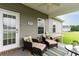 Comfortable patio seating area that features two lounge chairs with accent pillows, and an outdoor table at 206 Marley Ct., Conway, SC 29526