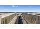 Scenic boardwalk access to the beach, providing stunning ocean views and a path to seaside relaxation at 2201 S Ocean Blvd. # 1603, Myrtle Beach, SC 29577