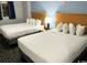 Comfortable bedroom featuring two beds with plush pillows and a relaxing ambiance at 2201 S Ocean Blvd. # 1603, Myrtle Beach, SC 29577