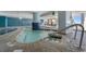 Indoor lazy river featuring shallow waters, blue accents, and nearby seating areas for relaxing at 2201 S Ocean Blvd. # 1603, Myrtle Beach, SC 29577