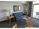 Comfortable living area with a sofa, side tables, and balcony with ocean views at 2201 S Ocean Blvd. # 1603, Myrtle Beach, SC 29577