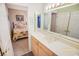 Bathroom that adjoins the bedroom, featuring a light wood vanity with large mirrors at 2203 Sweetwater Blvd. # 2203, Murrells Inlet, SC 29576