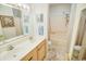 Bathroom featuring double sinks, framed mirror, tub and shower behind a curtain at 2203 Sweetwater Blvd. # 2203, Murrells Inlet, SC 29576
