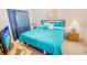 Bedroom features a cozy bed with a vibrant blue comforter, complemented by matching curtains at 2203 Sweetwater Blvd. # 2203, Murrells Inlet, SC 29576