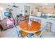 Cozy living room open to the kitchen, with seating around a wooden table at 2203 Sweetwater Blvd. # 2203, Murrells Inlet, SC 29576