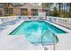 A refreshing outdoor pool with lounge chairs and a surrounding white fence for a relaxing getaway at 2203 Sweetwater Blvd. # 2203, Murrells Inlet, SC 29576