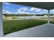Enjoy stunning water views from this covered back patio with lush green lawn at 242 Letha Dr, Longs, SC 29568