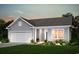 Charming home featuring a two-car garage, well-maintained lawn, and beautiful landscaping at 257 Hawks Run Dr., Calabash, NC 28467
