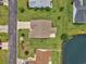 Aerial view of a single-Gathering home with a well-maintained lawn and a pond in the backyard at 286 Bonnie Bridge Circle, Myrtle Beach, SC 29579