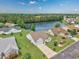 Scenic aerial view of a home next to a pond with lush green landscaping and a two car garage at 286 Bonnie Bridge Circle, Myrtle Beach, SC 29579