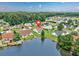 A home with lakeside views, lush greenery and landscaping plus a white fence near the pond at 286 Bonnie Bridge Circle, Myrtle Beach, SC 29579