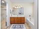Bathroom with wood vanity and large mirror at 286 Bonnie Bridge Circle, Myrtle Beach, SC 29579