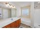 Bright bathroom featuring a combination tub and shower, single sink vanity, and neutral decor at 286 Bonnie Bridge Circle, Myrtle Beach, SC 29579