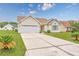 Inviting one-story home with a well-manicured lawn and a spacious driveway leading to a two-car garage at 286 Bonnie Bridge Circle, Myrtle Beach, SC 29579
