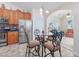 Open kitchen area features stainless steel appliances and breakfast table with seating for four at 286 Bonnie Bridge Circle, Myrtle Beach, SC 29579