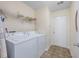 Functional laundry room with a washer, dryer, and shelving for storage at 286 Bonnie Bridge Circle, Myrtle Beach, SC 29579