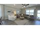 Comfortable living room featuring a sectional sofa, stylish decor, and plenty of natural light at 293 Eagle Claw Dr., Calabash, NC 28467