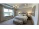 Serene main bedroom with a plush bed, ample natural light, and stylish decor, creating a relaxing retreat at 293 Eagle Claw Dr., Calabash, NC 28467