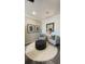 Cozy sitting area features two chairs, an ottoman, shiplap accent wall, and stylish decor at 293 Eagle Claw Dr., Calabash, NC 28467