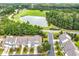 Aerial view overlooking meticulously landscaped community, pond, and golf course at 307 River Rock Ln. # 906, Murrells Inlet, SC 29576