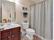 Clean bathroom with a vanity, toilet, and shower curtain at 307 River Rock Ln. # 906, Murrells Inlet, SC 29576