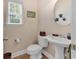 Comfortable bathroom with a pedestal sink, ceramic tile flooring, and ocean-themed decor at 307 River Rock Ln. # 906, Murrells Inlet, SC 29576