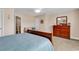 Comfortable bedroom featuring a bed, a sitting area, and a dresser at 307 River Rock Ln. # 906, Murrells Inlet, SC 29576
