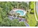 Aerial view of sparkling community pool with ample seating and manicured landscaping at 307 River Rock Ln. # 906, Murrells Inlet, SC 29576
