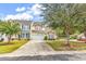 Beautiful two-story home boasts a long driveway and a well-maintained lawn with mature trees at 307 River Rock Ln. # 906, Murrells Inlet, SC 29576
