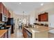 Well-equipped kitchen with granite countertops, stainless steel appliances, and an open breakfast bar at 307 River Rock Ln. # 906, Murrells Inlet, SC 29576