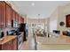 Spacious kitchen featuring sleek appliances, granite countertops, and ample bar seating at 307 River Rock Ln. # 906, Murrells Inlet, SC 29576