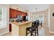 Modern kitchen features granite countertops, stainless steel appliances, and breakfast bar seating at 307 River Rock Ln. # 906, Murrells Inlet, SC 29576