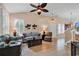 Bright living room featuring neutral walls, tile floors, and comfortable furnishings with a ceiling fan at 307 River Rock Ln. # 906, Murrells Inlet, SC 29576