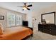 Bright bedroom with a large mirror, carpet flooring, and window with shutter-style blinds at 307 River Rock Ln. # 906, Murrells Inlet, SC 29576