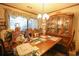 Traditional dining room showcasing a wooden table, china cabinet, and decorative accents at 312 73Rd Ave. N # 15, Myrtle Beach, SC 29572