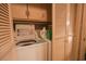 Laundry area with white washer and dryer units, plus storage cabinets at 312 73Rd Ave. N # 15, Myrtle Beach, SC 29572