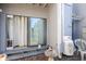 Outdoor patio area with sliding door access, featuring a tiled floor and cozy seating at 312 73Rd Ave. N # 15, Myrtle Beach, SC 29572