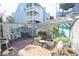 Outdoor patio featuring a brick floor, lush greenery, and cozy seating, perfect for relaxation and entertaining at 312 73Rd Ave. N # 15, Myrtle Beach, SC 29572