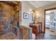 Stylish bathroom showcasing a walk-in stone shower, copper sink vanity, and modern fixtures at 406 26Th Ave N, North Myrtle Beach, SC 29582