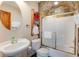 Bathroom boasts stone detailed wall, vessel sink, and modern fixtures, offering style and functionality at 406 26Th Ave N, North Myrtle Beach, SC 29582