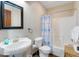 Bathroom featuring a pedestal sink, black framed mirror, and a shower/tub combination at 406 26Th Ave N, North Myrtle Beach, SC 29582