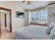 Bright bedroom boasts built-in shelves and a window seat for relaxing and enjoying the view at 406 26Th Ave N, North Myrtle Beach, SC 29582