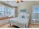 Cozy bedroom with a window seat, beach-themed decor, and bright natural light at 406 26Th Ave N, North Myrtle Beach, SC 29582