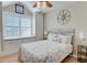 Charming bedroom featuring a window seat, ceiling fan, and coastal-themed decor for a relaxing atmosphere at 406 26Th Ave N, North Myrtle Beach, SC 29582