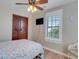 Cozy bedroom featuring a ceiling fan, window with view, and a calming coastal-inspired color palette at 406 26Th Ave N, North Myrtle Beach, SC 29582