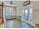Inviting entryway with a comfortable sofa, bright windows, and a view of the outdoor deck at 406 26Th Ave N, North Myrtle Beach, SC 29582