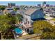 Beautiful home with a private pool, white picket fence, a deck, and views of the surrounding neighborhood and skyline at 406 26Th Ave N, North Myrtle Beach, SC 29582