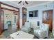 Comfortable living room with blue walls, a large TV, and stylish wicker chairs at 406 26Th Ave N, North Myrtle Beach, SC 29582